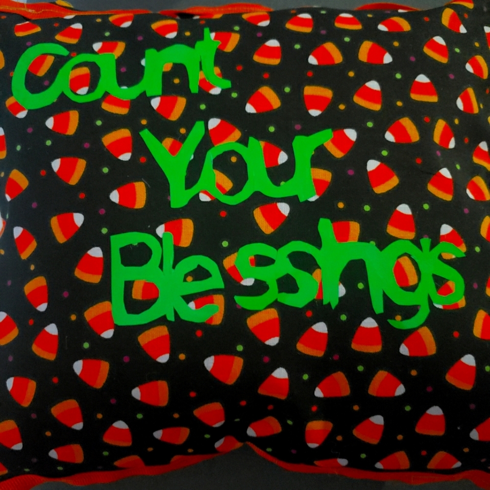 Pillow with candy corns. Says Count your blessings!!